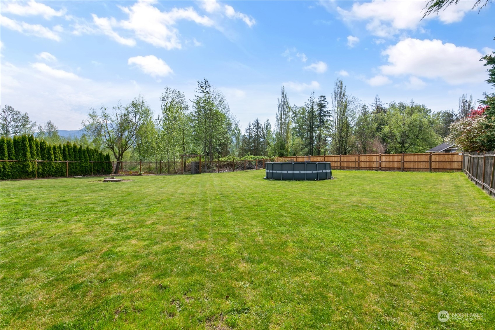 310 Allison Way Nooksack, WA 98276 - Photo 29 of 35 a view of outdoor space with deck and trees