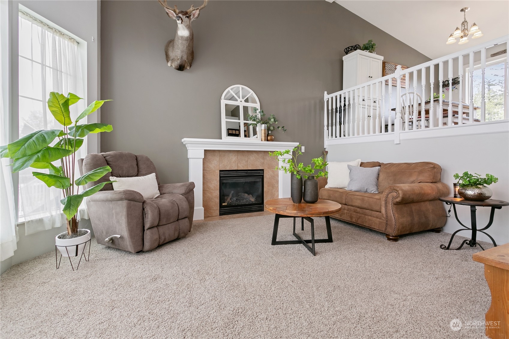 310 Allison Way Nooksack, WA 98276 - Photo 3 of 35 a living room with furniture a fireplace and a potted plant