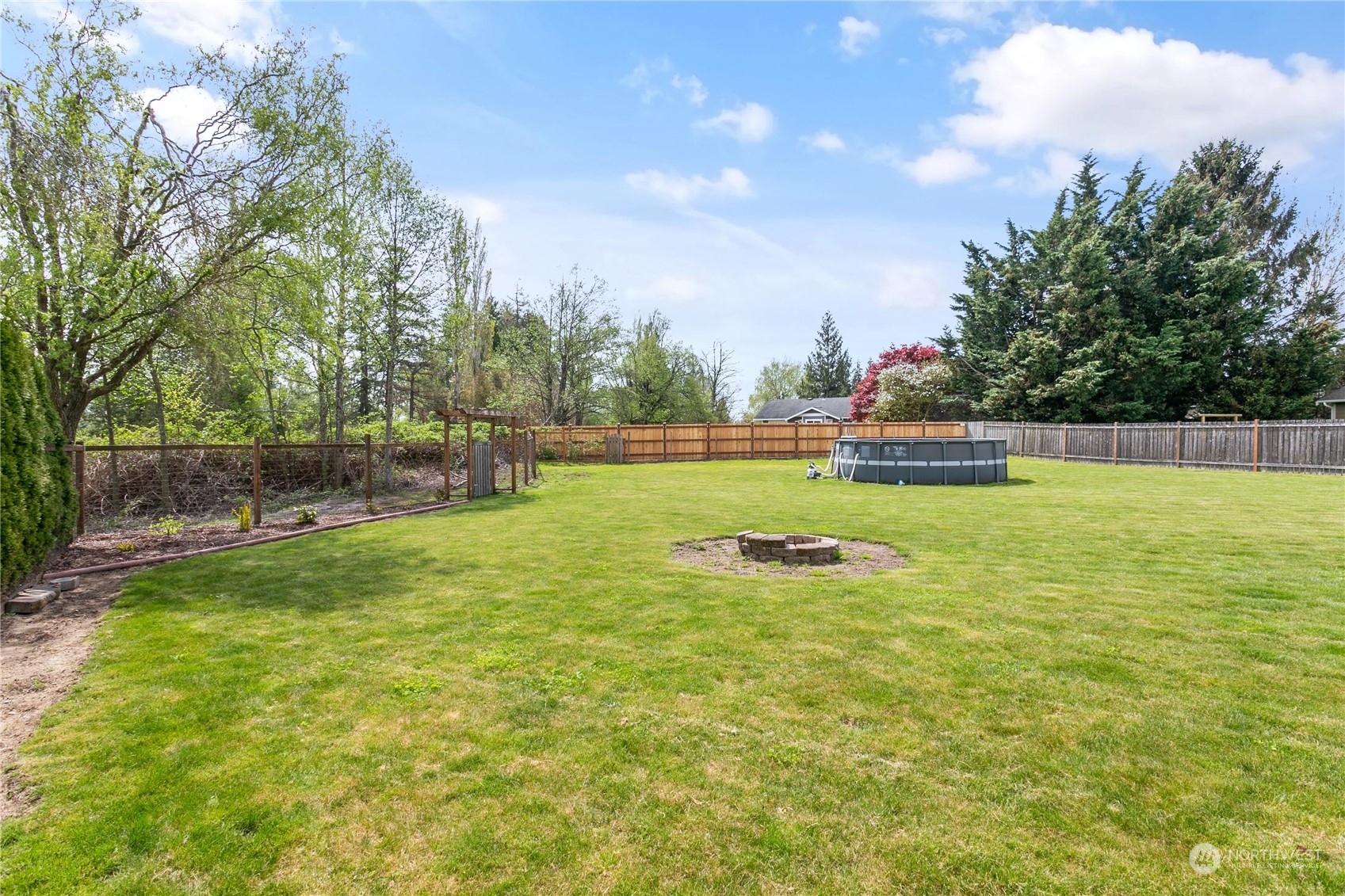 310 Allison Way Nooksack, WA 98276 - Photo 33 of 35 a view of outdoor space with deck and trees