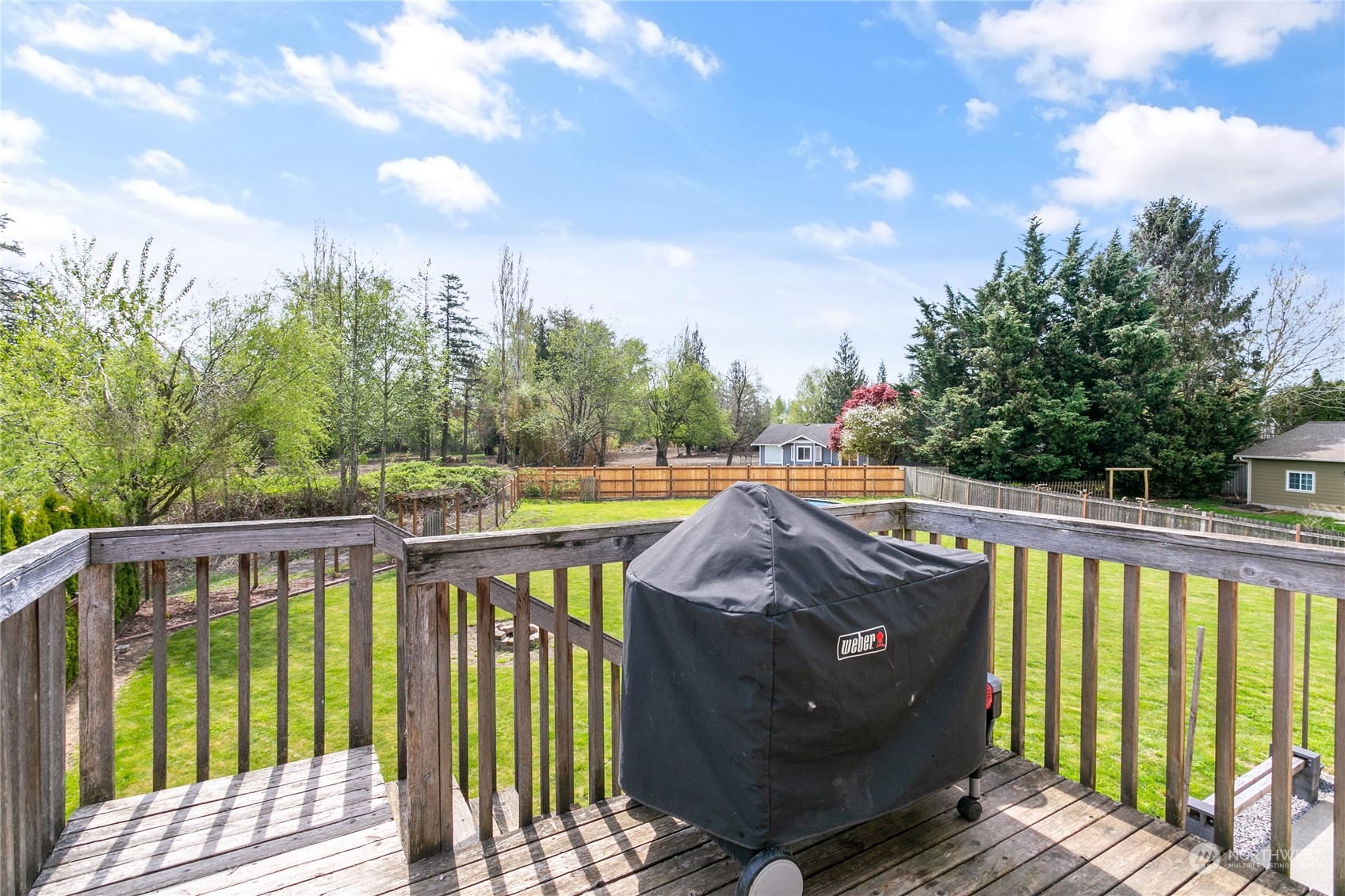 310 Allison Way Nooksack, WA 98276 - Photo 35 of 35 a view of a swimming pool with a patio and wooden fence