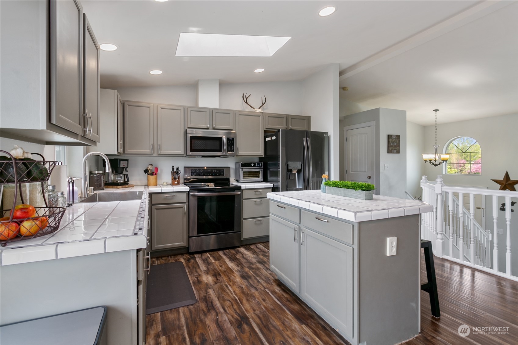 310 Allison Way Nooksack, WA 98276 - Photo 5 of 35 a kitchen with a sink window and stainless steel appliances