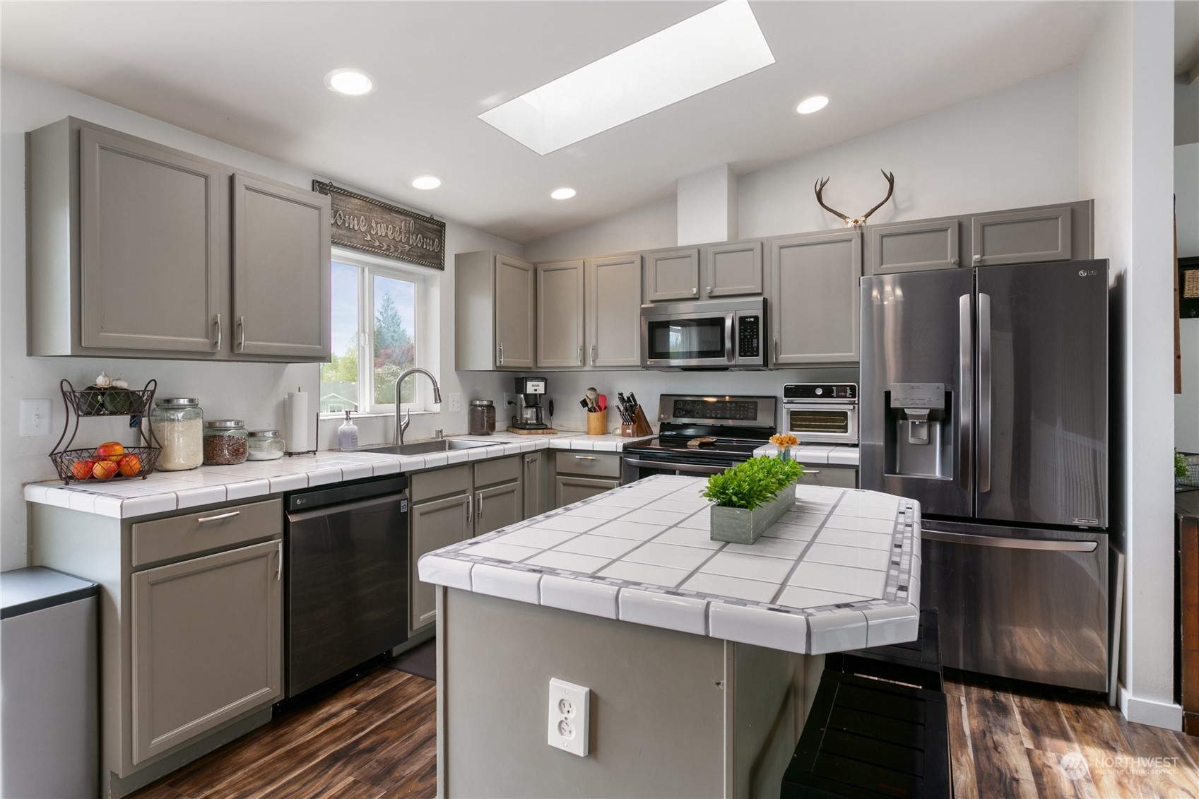 310 Allison Way Nooksack, WA 98276 - Photo 10 of 35 a kitchen with a sink stainless steel appliances and refrigerator