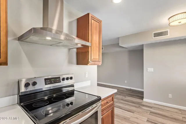 a kitchen with a stove and a microwave