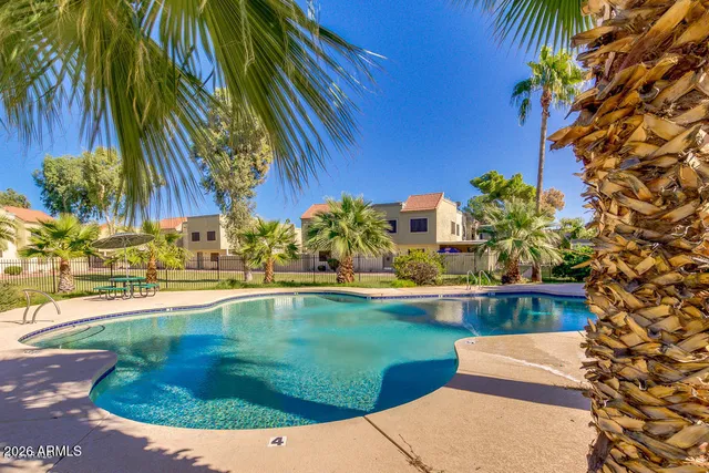 a view of swimming pool with a yard