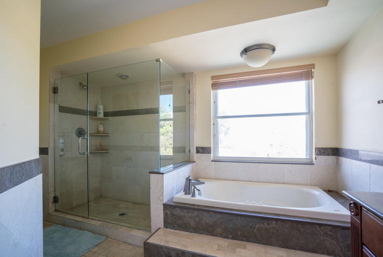 9721 Enchanted Pointe Lane Boca Raton, FL 33496 - Photo 11 of 25 a bathroom with a bathtub and shower