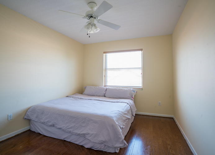 9721 Enchanted Pointe Lane Boca Raton, FL 33496 - Photo 15 of 25 a bedroom with a bed and a window