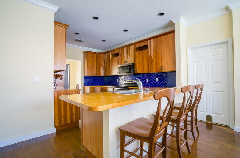 9721 Enchanted Pointe Lane Boca Raton, FL 33496 - Photo 5 of 25 a view of a dining room with furniture and wooden floor