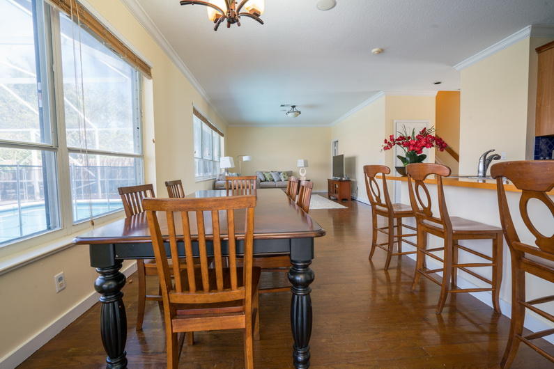 9721 Enchanted Pointe Lane Boca Raton, FL 33496 - Photo 6 of 25 a view of a dining room with furniture window and wooden floor
