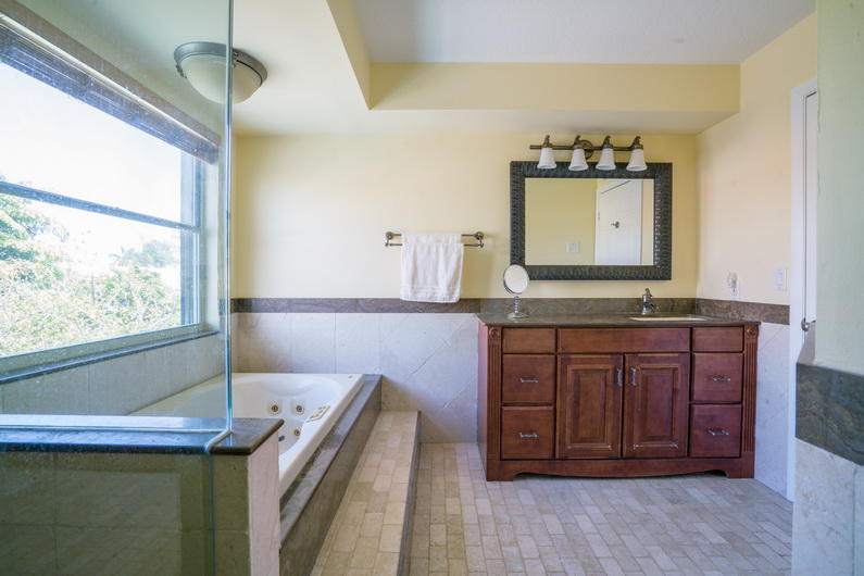 9721 Enchanted Pointe Lane Boca Raton, FL 33496 - Photo 10 of 25 a view of a kitchen with a sink and a dishwasher