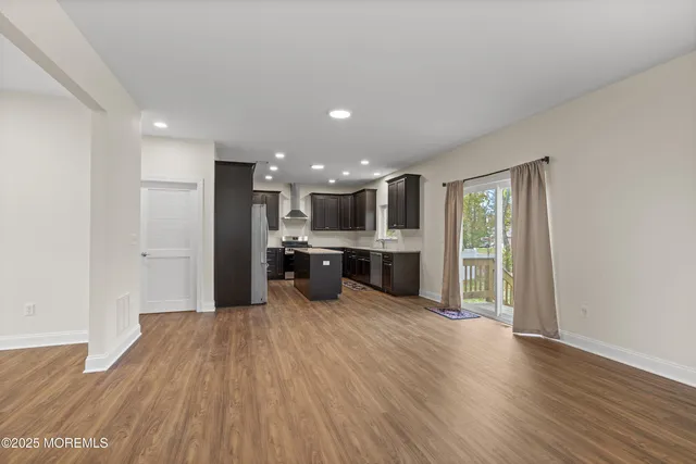 a view of kitchen with wooden floor