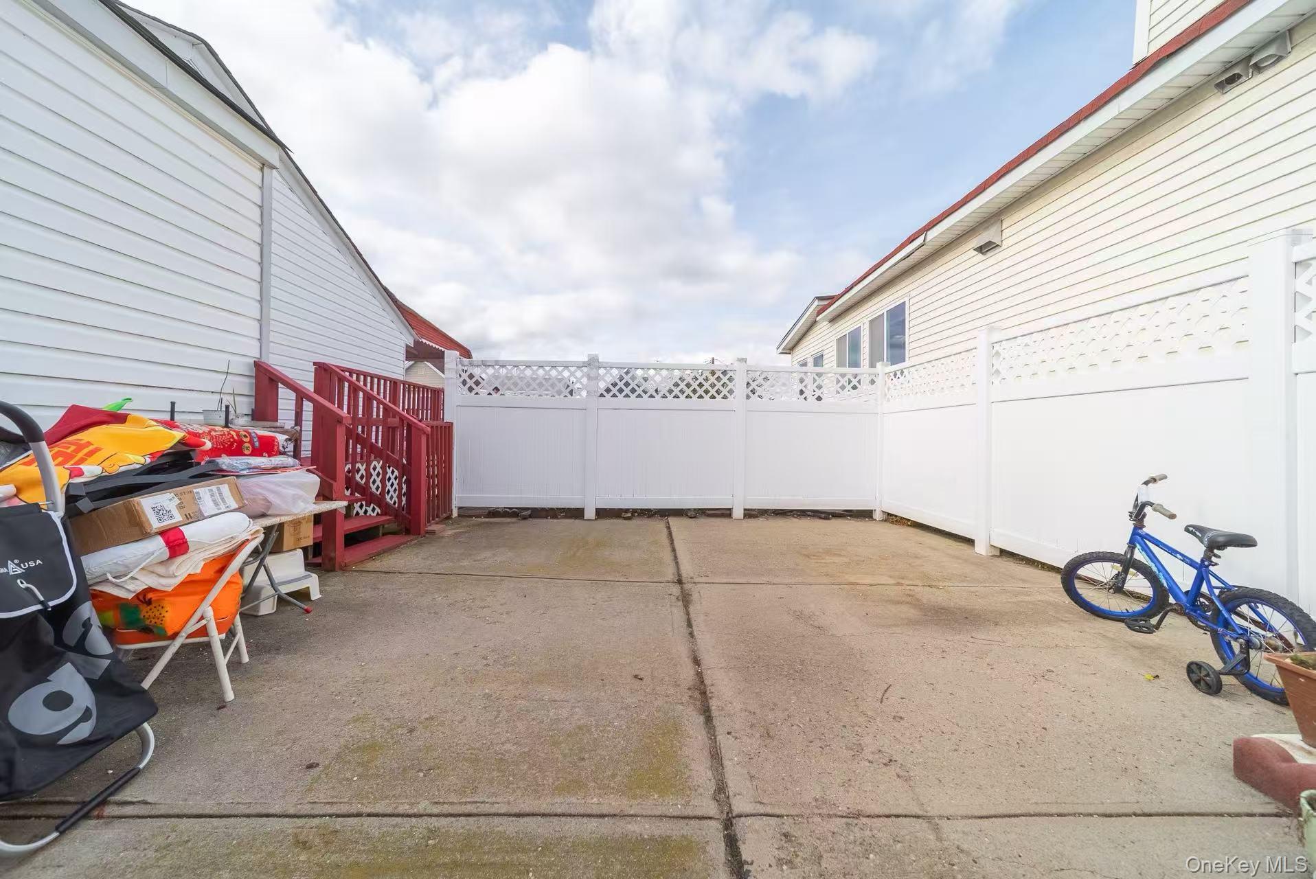 10 Church Street Queens, NY 11414 - Photo 14 of 19 Fenced backyard featuring a patio