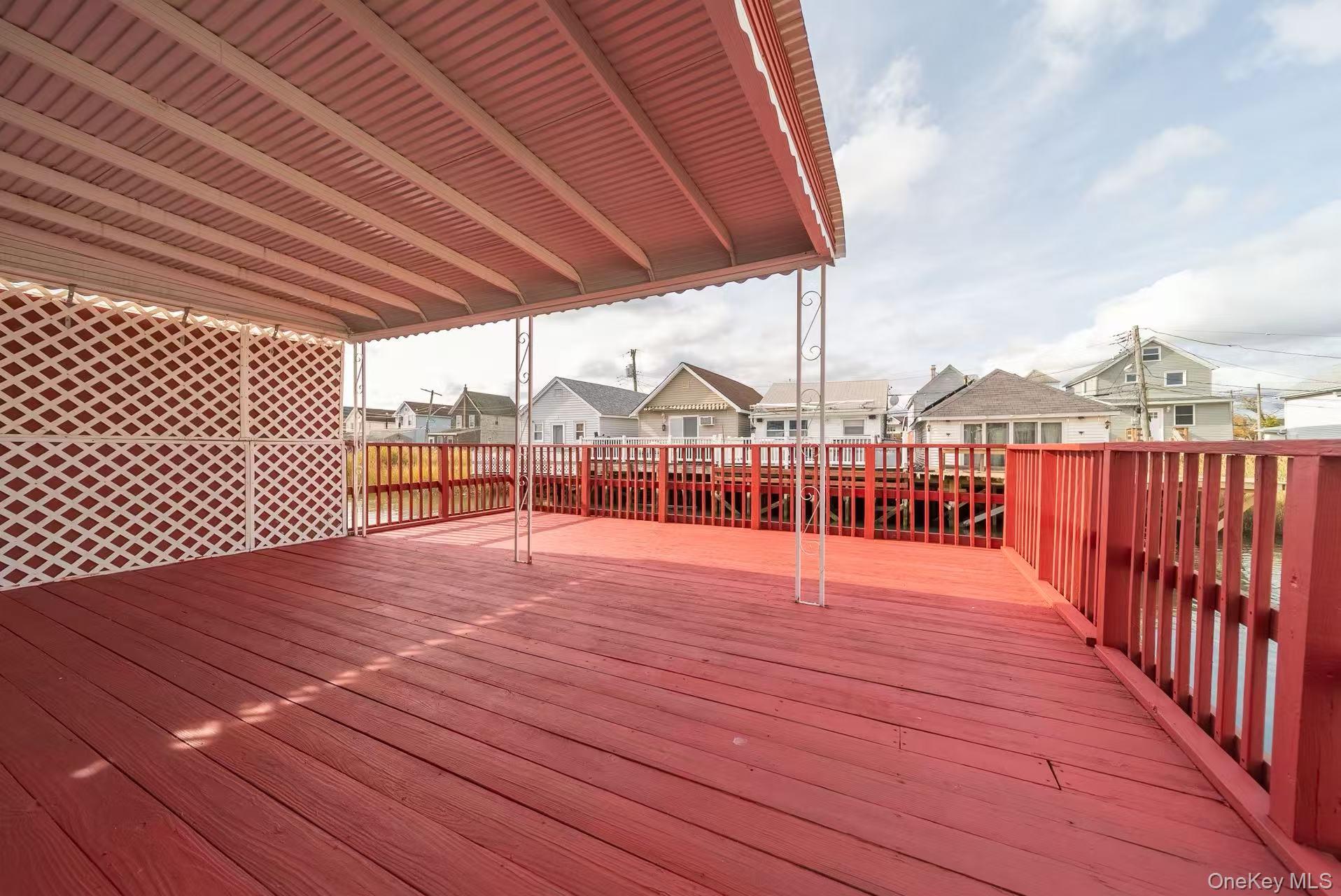 10 Church Street Queens, NY 11414 - Photo 16 of 19 Wooden deck with a residential view