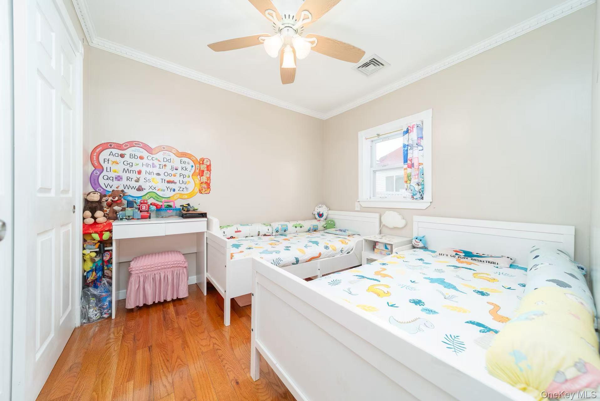 10 Church Street Queens, NY 11414 - Photo 10 of 19 Bedroom featuring ornamental molding, light wood-style floors, and ceiling fan