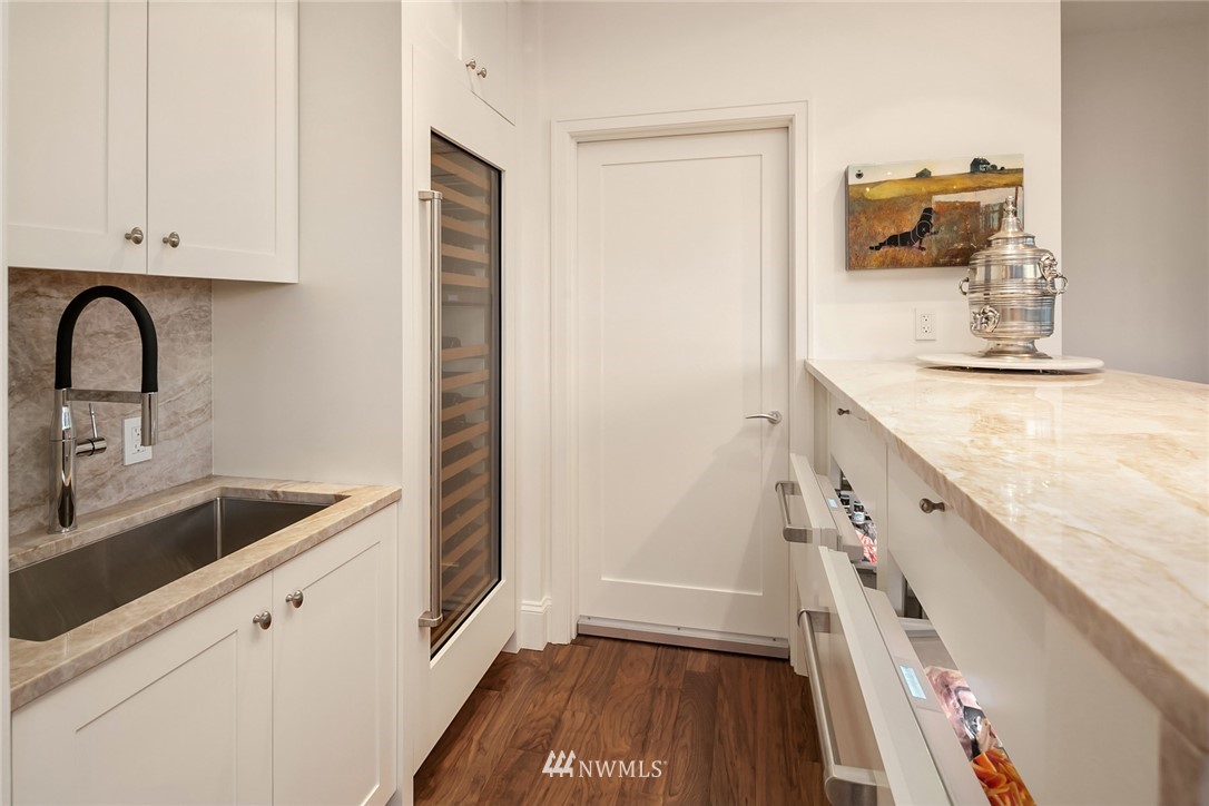 10700 Northeast 4th Street, Unit 4202 Bellevue, WA 98004 - Photo 14 of 40 a kitchen with a sink and a stove top oven