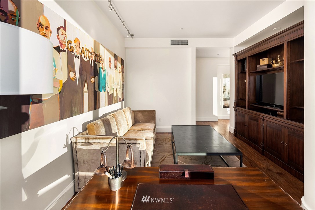 10700 Northeast 4th Street, Unit 4202 Bellevue, WA 98004 - Photo 20 of 40 a living room with furniture and a flat screen tv