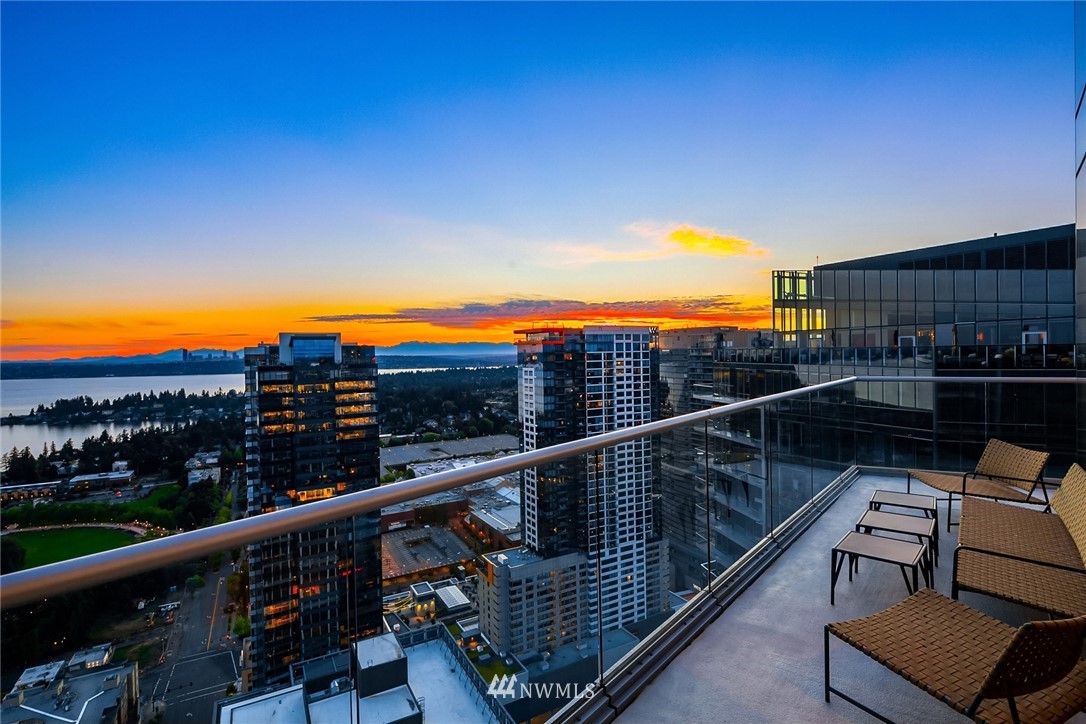 10700 Northeast 4th Street, Unit 4202 Bellevue, WA 98004 - Photo 3 of 40 a view of a balcony with wooden floor and city view