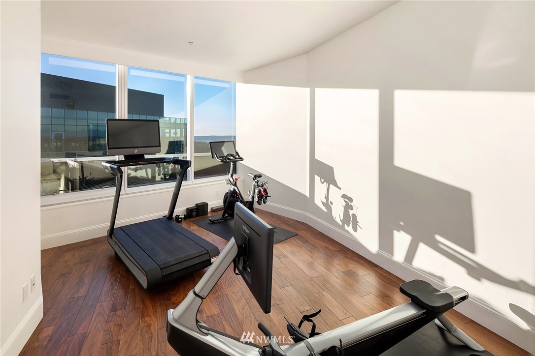 10700 Northeast 4th Street, Unit 4202 Bellevue, WA 98004 - Photo 23 of 40 a living room with furniture and a flat screen tv