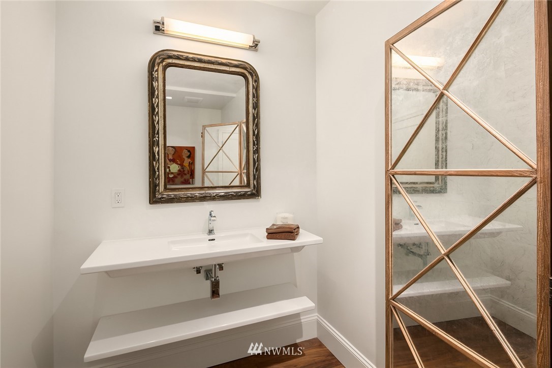 10700 Northeast 4th Street, Unit 4202 Bellevue, WA 98004 - Photo 24 of 40 a bathroom with a sink and mirror
