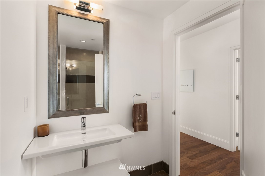 10700 Northeast 4th Street, Unit 4202 Bellevue, WA 98004 - Photo 25 of 40 a bathroom with a sink and a mirror