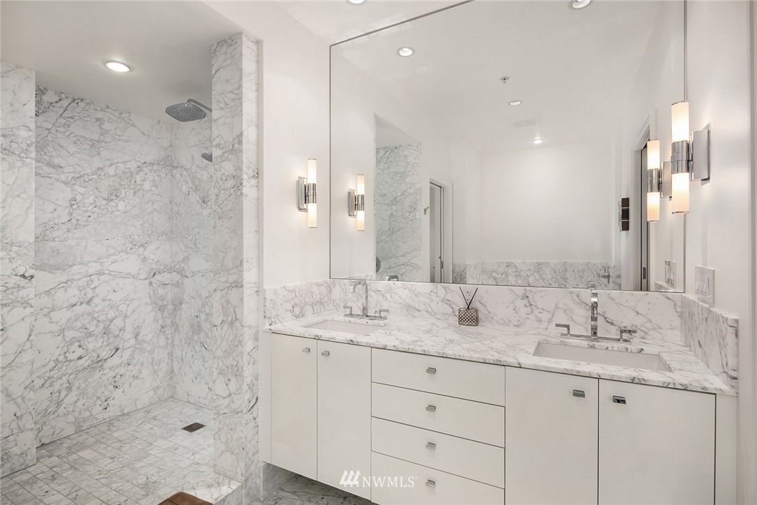 10700 Northeast 4th Street, Unit 4202 Bellevue, WA 98004 - Photo 30 of 40 a bathroom with a granite countertop sink mirror and double
