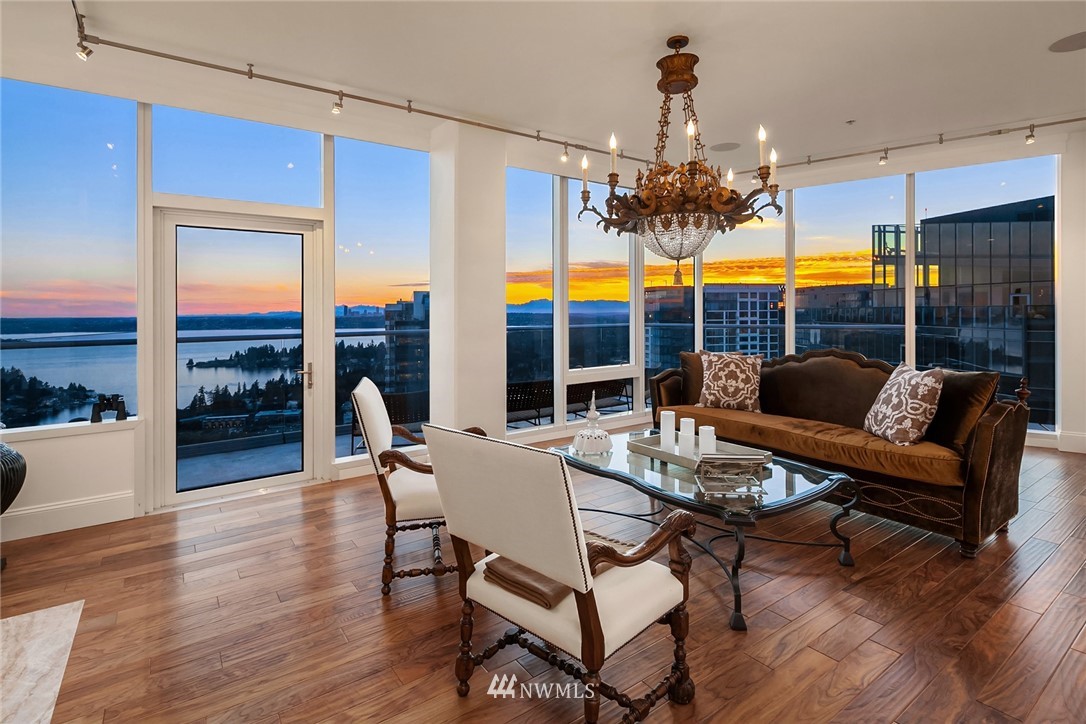 10700 Northeast 4th Street, Unit 4202 Bellevue, WA 98004 - Photo 6 of 40 a view of a dining room with furniture wooden floor and chandelier