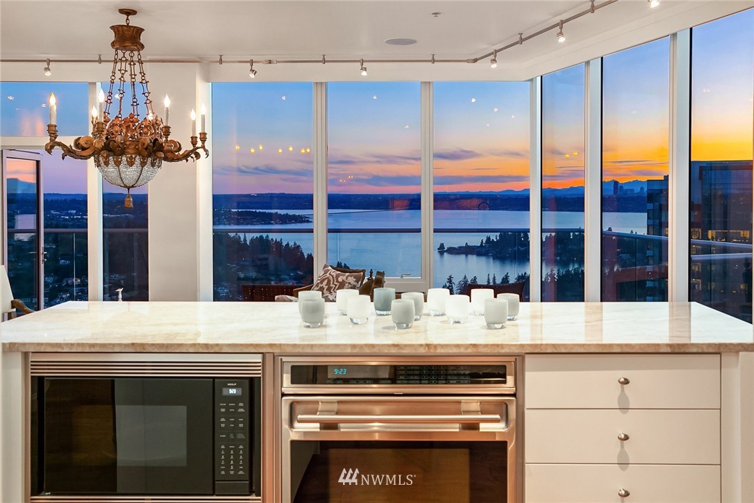 10700 Northeast 4th Street, Unit 4202 Bellevue, WA 98004 - Photo 8 of 40 a kitchen with a table and chairs