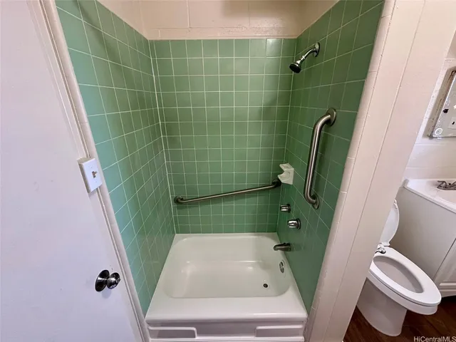 a bathroom with a sink and toilet