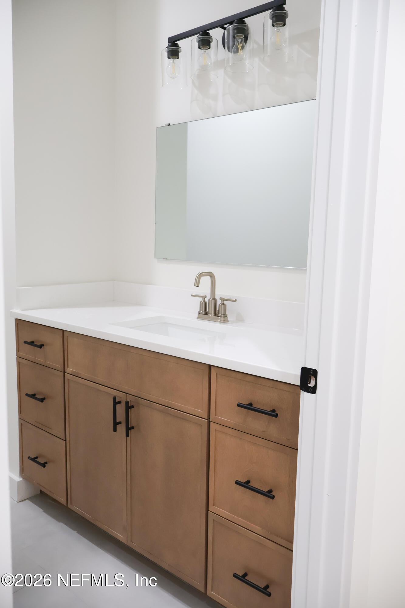 261121 Rowe Road Hilliard, FL 32046 - Photo 28 of 33 a bathroom with a sink and vanity
