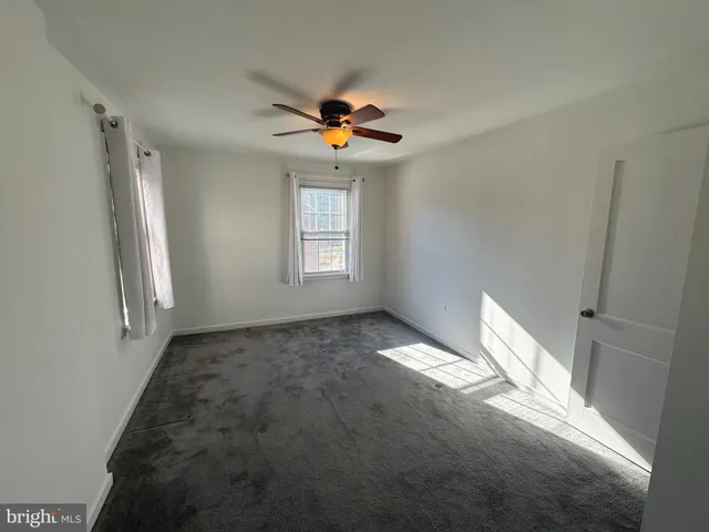 a view of livingroom with hardwood floor and ceiling fan