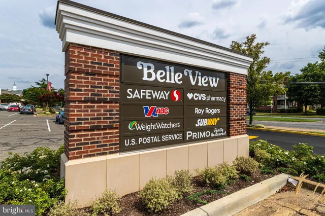 a view of a cars park in front of a building