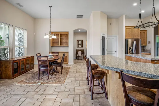 a view of a dining room with furniture window and outside view