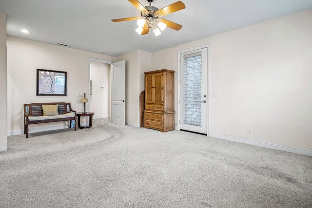 a bathroom with a sink a vanity a mirror and a bathtub