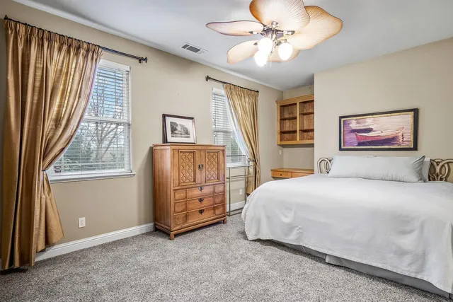 a bathroom with 2 sink and a mirror