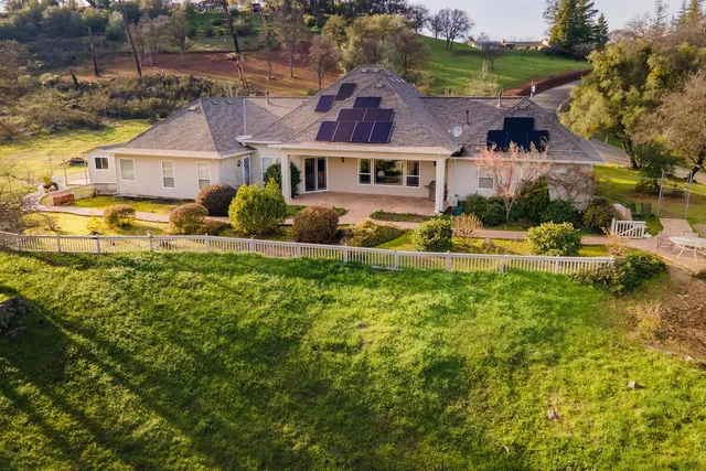 an aerial view of house with a swimming pool