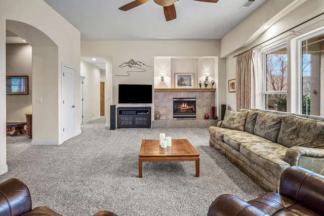 a view of a livingroom with furniture and a window