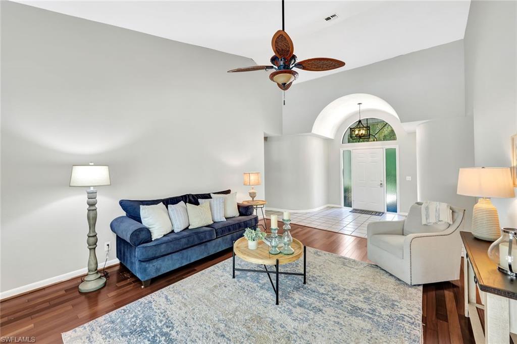 4530 13th Avenue Southwest Naples, FL 34116 - Photo 11 of 30 a living room with furniture a rug and a large window