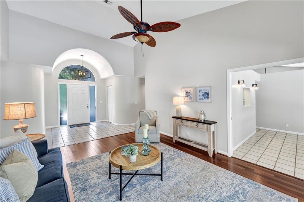 4530 13th Avenue Southwest Naples, FL 34116 - Photo 12 of 30 a living room with furniture and a wooden floor