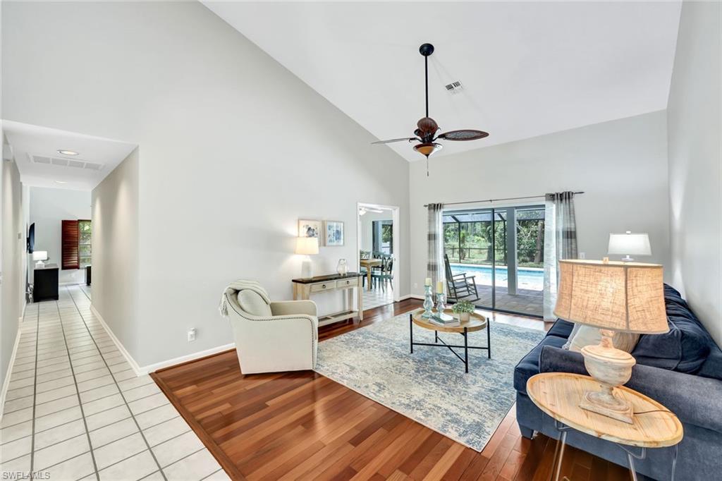 4530 13th Avenue Southwest Naples, FL 34116 - Photo 13 of 30 a living room with furniture and a table