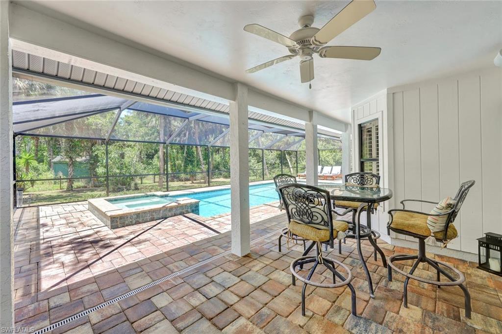 4530 13th Avenue Southwest Naples, FL 34116 - Photo 23 of 30 a dining room with furniture and large windows
