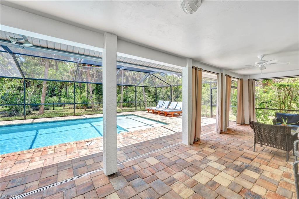 4530 13th Avenue Southwest Naples, FL 34116 - Photo 25 of 30 a view of a porch with furniture and garden