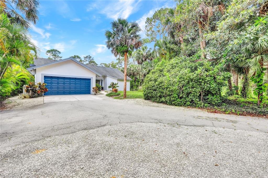 4530 13th Avenue Southwest Naples, FL 34116 - Photo 29 of 30 a house with a yard