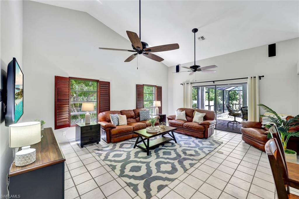 4530 13th Avenue Southwest Naples, FL 34116 - Photo 5 of 30 a living room with furniture and a large window