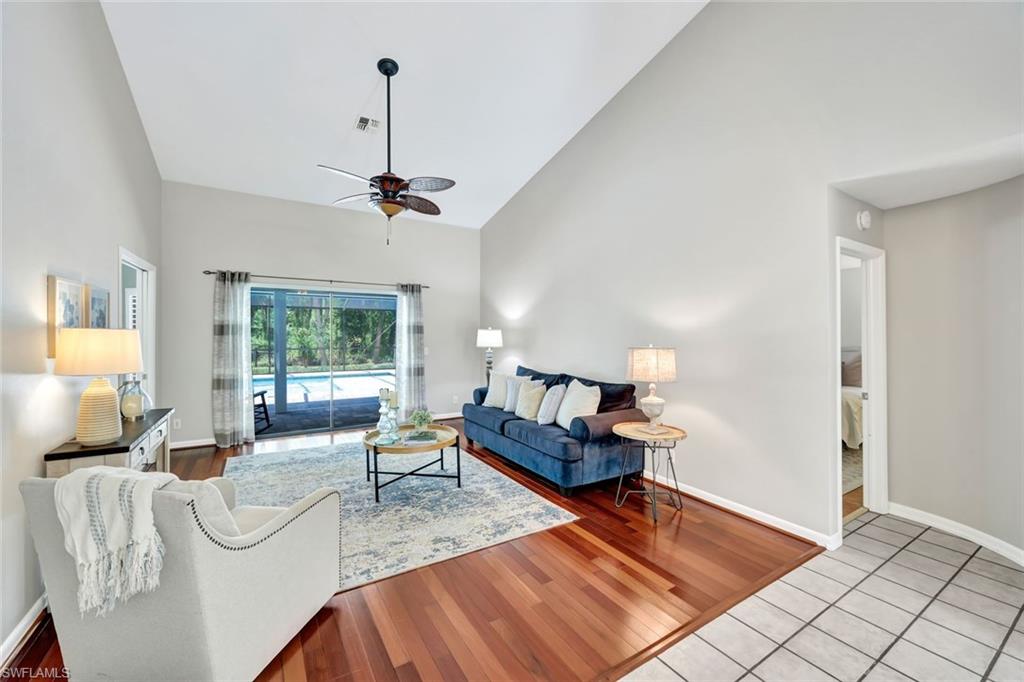 4530 13th Avenue Southwest Naples, FL 34116 - Photo 10 of 30 a living room with furniture and a window