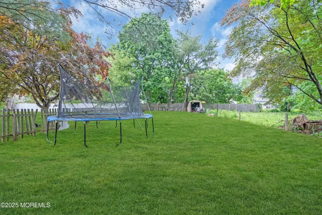 a view of green field with sitting area