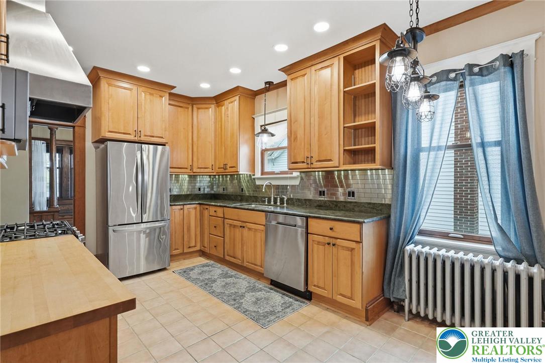 802 Poplar Street Clarks Summit, PA 18411 - Photo 19 of 50 a kitchen with stainless steel appliances granite countertop a refrigerator and a sink
