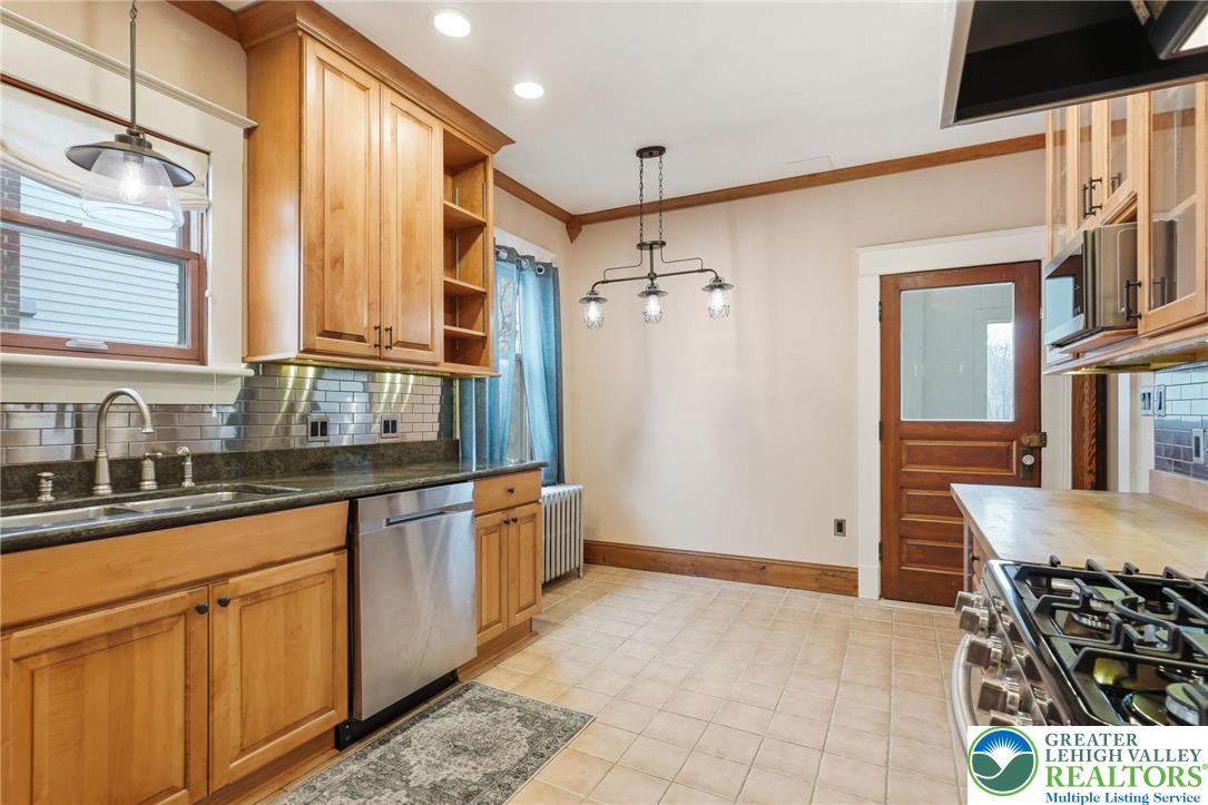 802 Poplar Street Clarks Summit, PA 18411 - Photo 21 of 50 a kitchen with stainless steel appliances granite countertop a refrigerator and a sink