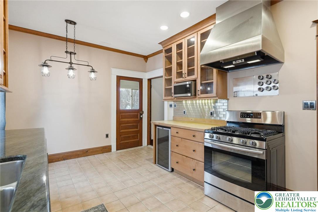802 Poplar Street Clarks Summit, PA 18411 - Photo 22 of 50 a kitchen with stainless steel appliances a stove and a refrigerator