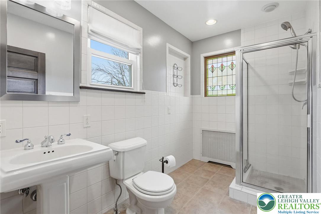 802 Poplar Street Clarks Summit, PA 18411 - Photo 24 of 50 a bathroom with a sink a toilet and shower