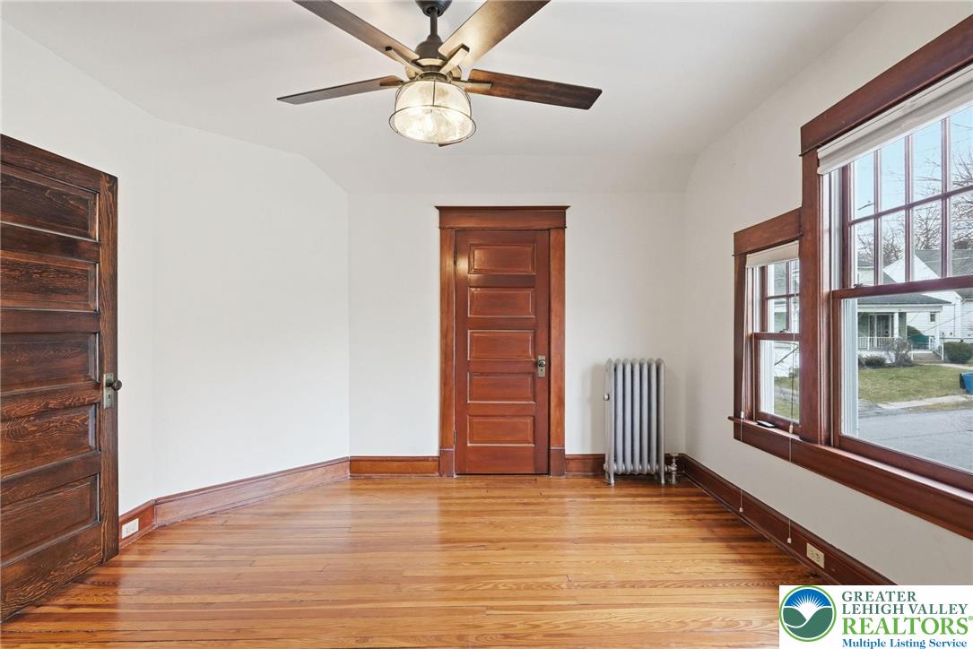 802 Poplar Street Clarks Summit, PA 18411 - Photo 33 of 50 a view of an empty room with wooden floor and window