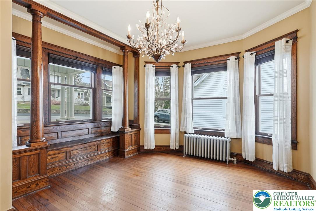 802 Poplar Street Clarks Summit, PA 18411 - Photo 7 of 50 a hallway with a large window and wooden floor